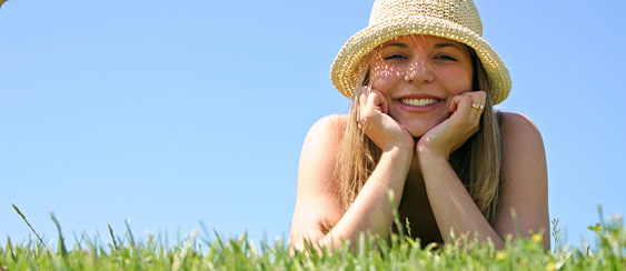 photo of woman lying in grass